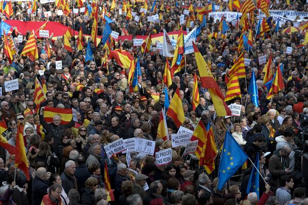Demonstrators wave European, Spanish and Catalan flags during a demonstration called by Sociedat Civil Catalana (Catalan Civil Society) to support the unity of Spain, at Catalonia square in Barcelona Demonstrators wave European, Spanish and Catalan flags during a demonstration called by Sociedat Civil Catalana (Catalan Civil Society) to support the unity of Spain, at Catalonia square in Barcelona - Sputnik International
