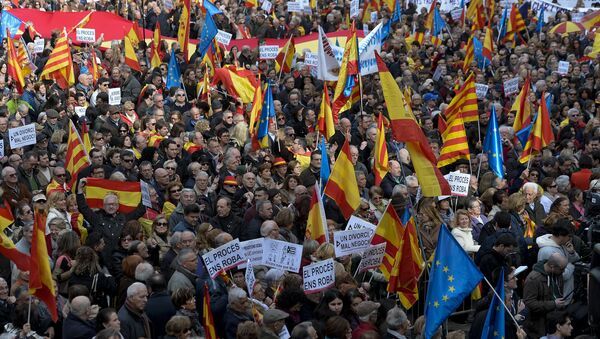 Demonstrators wave European, Spanish and Catalan flags during a demonstration called by Sociedat Civil Catalana (Catalan Civil Society) to support the unity of Spain, at Catalonia square in Barcelona - Sputnik International