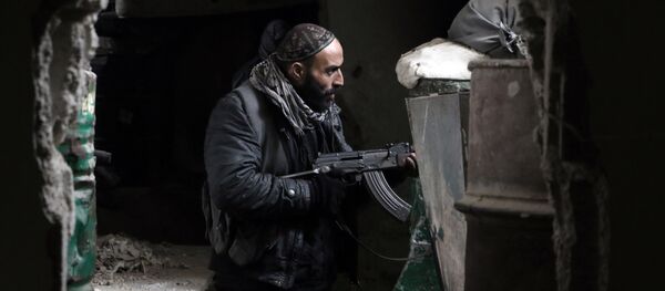 A fighter from the Jaish al-Islam (Islam Army), the foremost rebel group in Damascus province guards a position on the front line in Jobar, on the eastern edge of the Syrian capital A fighter from the Jaish al-Islam (Islam Army), the foremost rebel group in Damascus province guards a position on the front line in Jobar, on the eastern edge of the Syrian capital - Sputnik International