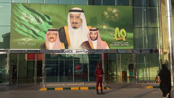 FILE -- In this Dec. 14, 2015 file photo, images of King Salman, center, Crown Prince Mohammed bin Nayef , left, and Deputy Crown Prince Mohammed bin Salman hang at the entrance of a shopping center in Riyadh, Saudi Arabia to mark the country's 85th anniversary - Sputnik International