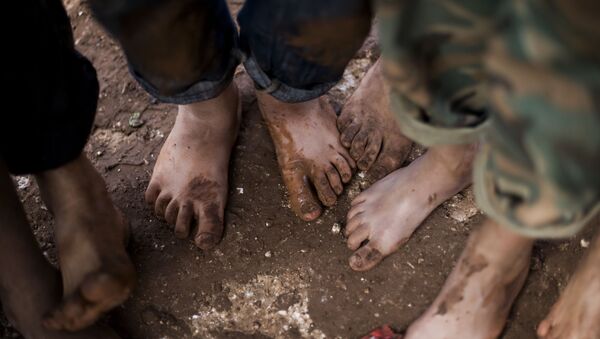 FILE - In this file photo taken Friday, Oct. 26, 2012, displaced Syrian children gather barefoot in a refugee camp near Atma, Idlib province, Syria - Sputnik International