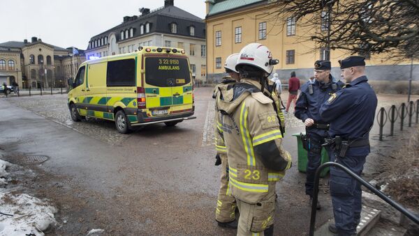 Emergency personnel stand outside a school after a loud explosion was heard Tuesday Feb. 2, 2016 in the centre of Karlstad in Sweden - Sputnik International