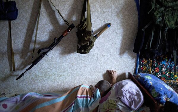A member of a rapid response unit rests in a barrack before a curfew patrol in Lugansk - Sputnik International