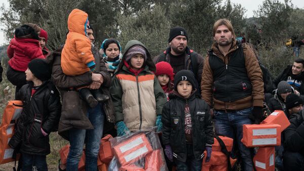 Migrants wait to travel to Greek island of Lesbos, near the Aegean town of Ayvacik, Turkey, Friday, Jan. 29, 2016 - Sputnik International