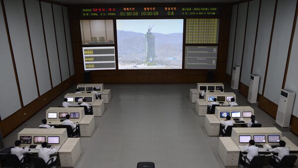 North Korea technicians watch live images of the rocket Unah-3 at the satellite control room of the space center on the outskirts of Pyongyang on April 11, 2012 (File) - Sputnik International