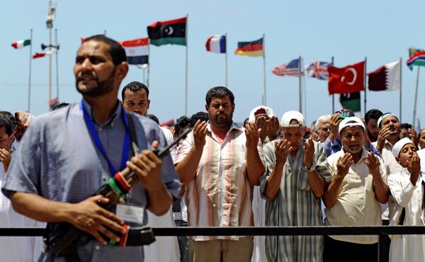 Libyans pray during Friday prayers, in the rebel-held Benghazi, Libya, Friday, July 8, 2011. Libyans pray during Friday prayers, in the rebel-held Benghazi, Libya, Friday, July 8, 2011. - Sputnik International