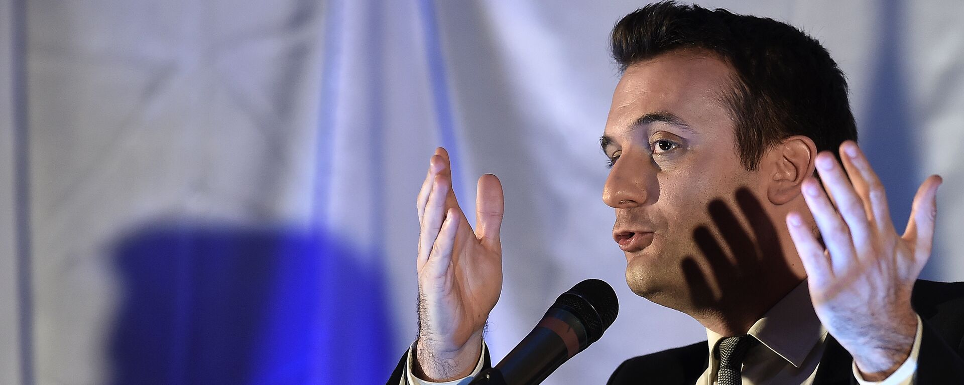 Florian Philippot, French far-right Front National (FN) party vice-president and top candidate for the December regional elections in the eastern Alsace-Champagne-Ardenne-Lorraine region, delivers a speech during a campaign meeting in Kintzheim, eastern France, on December 9, 2015 - Sputnik International, 1920, 20.04.2024