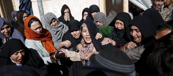 Family members weep at the funeral for one of the victims of last night suicide car bomb attack in Kabul, Afghanistan January 21, 2016 Family members weep at the funeral for one of the victims of last night suicide car bomb attack in Kabul, Afghanistan January 21, 2016 - Sputnik International