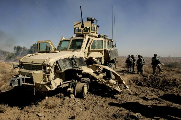 U.S. soldiers secure the area next to a damaged U.S. mine resistant, ambush protected vehicle (MRAP), after a roadside bomb explosion during an operation in the area of Al-leg, some 40 miles south of Baghdad, Iraq (File) U.S. soldiers secure the area next to a damaged U.S. mine resistant, ambush protected vehicle (MRAP), after a roadside bomb explosion during an operation in the area of Al-leg, some 40 miles south of Baghdad, Iraq (File) - Sputnik International