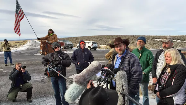 Ammon Bundy speaks to reporters at the Malheur National Wildlife Refuge in Burns, Ore., on Thursday, Jan. 14, 2016 - Sputnik International