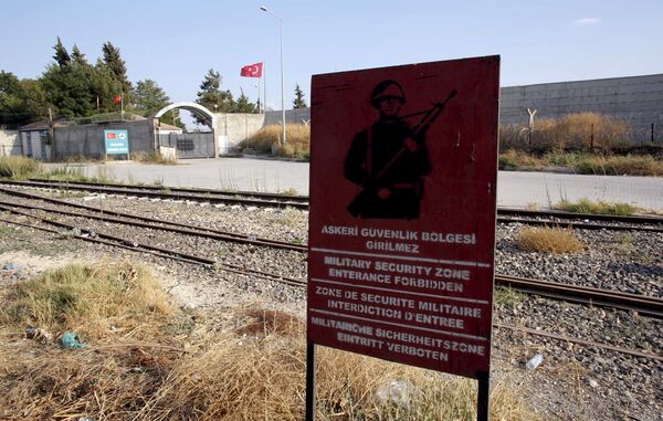 A Turkish military warning sign, with the closed Karkamis border gate in the background, is pictured in Karkamis, bordering with the Islamic State-held Syrian town of Jarablus, in Gaziantep province, Turkey, in this August 1, 2015 file photo A Turkish military warning sign, with the closed Karkamis border gate in the background, is pictured in Karkamis, bordering with the Islamic State-held Syrian town of Jarablus, in Gaziantep province, Turkey, in this August 1, 2015 file photo - Sputnik International