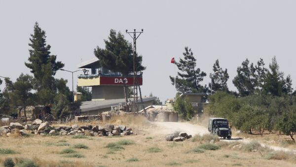 A Turkish military vehicle leaves from the Dag military post, which was attacked by Islamic State militants, on the Turkish-Syrian border near Kilis, Turkey, intros July 24, 2015 file photo - Sputnik International
