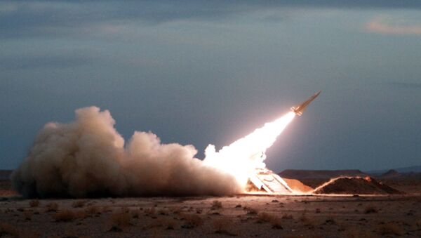 A Hawk surface-to-air missile is launched during military maneuvers at an undisclosed location in Iran on November 13, 2012 - Sputnik International
