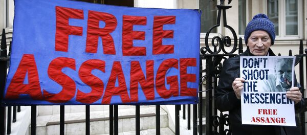 A demonstrator holds a banner outside the Ecuadorean Embassy in London, where Wikileaks founder Julian Assange is staying, Thursday, Feb. 4, 2016 A demonstrator holds a banner outside the Ecuadorean Embassy in London, where Wikileaks founder Julian Assange is staying, Thursday, Feb. 4, 2016 - Sputnik International