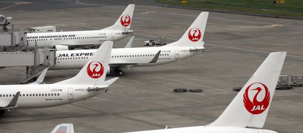 This picture taken on April 29, 2014 shows Japanese air carrier Japan Airlines planes parked on the tarmac at Tokyo's Haneda airport This picture taken on April 29, 2014 shows Japanese air carrier Japan Airlines planes parked on the tarmac at Tokyo's Haneda airport - Sputnik International