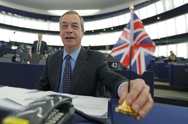 Nigel Farage, leader of the United Kingdom Independence Party (UKIP) and Member of the European Parliament, holds a British Union Jack flag as he arrives to take part in a debate on the upcoming summit and EU referendum in the UK, at the European Parliament in Strasbourg, France, February 3, 2016 Nigel Farage, leader of the United Kingdom Independence Party (UKIP) and Member of the European Parliament, holds a British Union Jack flag as he arrives to take part in a debate on the upcoming summit and EU referendum in the UK, at the European Parliament in Strasbourg, France, February 3, 2016 - Sputnik International