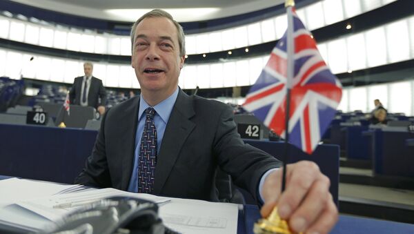 Nigel Farage, leader of the United Kingdom Independence Party (UKIP) and Member of the European Parliament, holds a British Union Jack flag as he arrives to take part in a debate on the upcoming summit and EU referendum in the UK, at the European Parliament in Strasbourg, France, February 3, 2016 - Sputnik International