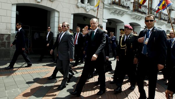 Turkish President Tayyip Erdogan waves next to Ecuador's Foreign Affairs Ricardo Patino while walking into Carondelet Palace in Quito, Ecuador, February 4, 2016 - Sputnik International