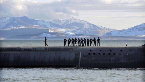 British Navy personnel stand atop the Trident Nuclear Submarine, HMS Victorious, on patrol off the west coast of Scotland on April 4, 2013 before the visit of British Prime Minister David Cameron. - Sputnik International