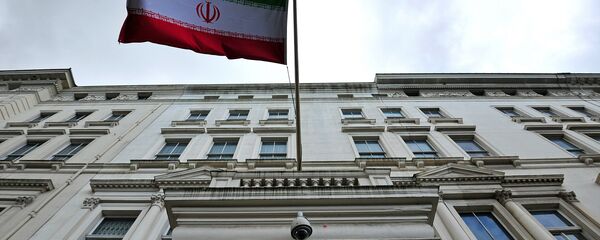 The Iranian flag hangs outside the Iranian embassy in central London on February 20, 2014 - Sputnik International