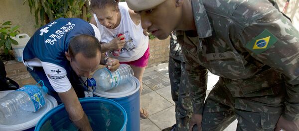 Soldiers and a Health Ministry agent look for larvae of Aedes aegypti mosquito, vector of the Zika, Dengue ans Chikungunya viruses, during an operation to fight them in Sao Paulo, Brazil on February 3, 2016 Soldiers and a Health Ministry agent look for larvae of Aedes aegypti mosquito, vector of the Zika, Dengue ans Chikungunya viruses, during an operation to fight them in Sao Paulo, Brazil on February 3, 2016 - Sputnik International