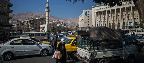 Pedestrians on a street in Damascus. - Sputnik International