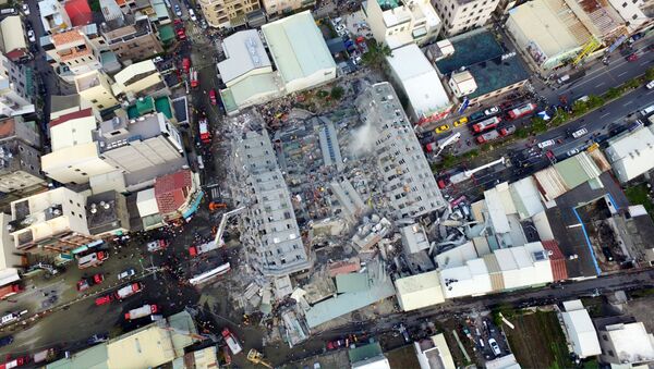 A site where buildings collapsed is seen in this aerial picture taken after a powerful earthquake hit Tainan, southern Taiwan, February 6, 2016 - Sputnik International