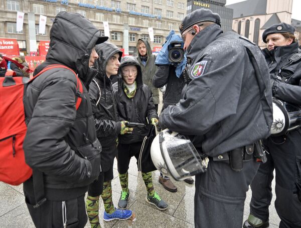 Police check toy guns during the start of the street carnival in Cologne, Germany. Police check toy guns during the start of the street carnival in Cologne, Germany. - Sputnik International