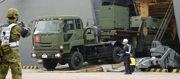 A Japanese Self-Defense Forces' vehicle carrying units of Patriot Advanced Capability-3 (PAC-3) missiles leaves a port on Japan's southern island of Ishigaki, Okinawa prefecture, in this photo taken by Kyodo February 6, 2016. - Sputnik International
