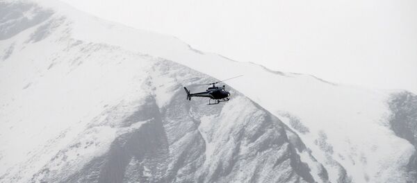 Rescue helicopters fly over the mountainside. Rescue helicopters fly over the mountainside. - Sputnik International