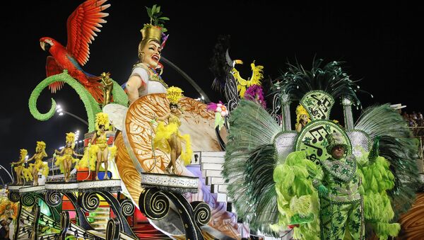 Dancers from the Unidos do Peruche samba school perform on a float during a carnival parade in Sao Paulo, Brazil, Saturday, Feb. 6, 2016 - Sputnik International