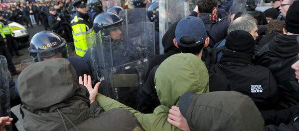 Members of the Garda Public Order Unit and riot police confront protestors at an anti-racism demonstration against the launch of an Irish branch of PEGIDA in Dublin, Ireland Members of the Garda Public Order Unit and riot police confront protestors at an anti-racism demonstration against the launch of an Irish branch of PEGIDA in Dublin, Ireland - Sputnik International