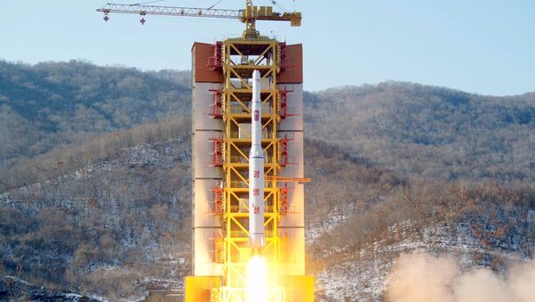 A North Korean long-range rocket is launched into the air at the Sohae rocket launch site, North Korea - Sputnik International