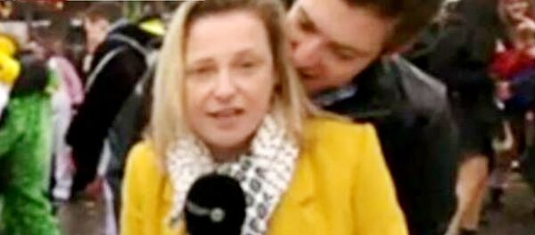 A screenshot of RTBF journalist Esmeralda Labye being groped in front of a live camera at Carnival in Cologne A screenshot of RTBF journalist Esmeralda Labye being groped in front of a live camera at Carnival in Cologne - Sputnik International