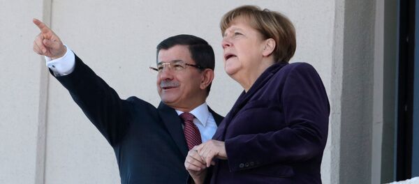 German Chancellor Angela Merkel, right, and Turkish Prime Minister Ahmet Davutoglu speak as they look towards the city center after a welcome ceremony in Ankara, Turkey, Monday, Feb. 8, 2016. German Chancellor Angela Merkel, right, and Turkish Prime Minister Ahmet Davutoglu speak as they look towards the city center after a welcome ceremony in Ankara, Turkey, Monday, Feb. 8, 2016. - Sputnik International