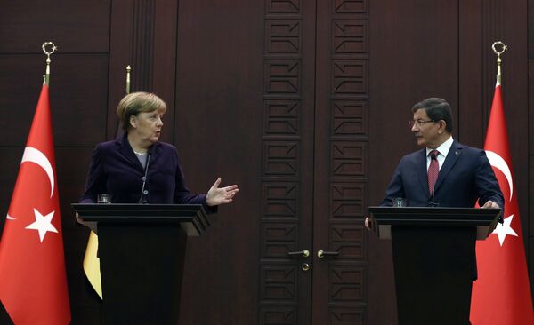 German Chancellor Angela Merkel, left, speaks to the media during a joint news conference with Turkish Prime Minister Ahmet Davutoglu in Ankara, Turkey, Monday, Feb. 8, 2016. German Chancellor Angela Merkel, left, speaks to the media during a joint news conference with Turkish Prime Minister Ahmet Davutoglu in Ankara, Turkey, Monday, Feb. 8, 2016. - Sputnik International