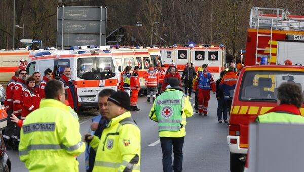 Rescue personnel wait in Bad Aibling, Germany, Tuesday, Feb. 9, 2016, after two regional trains crashed killing at least two people. - Sputnik International
