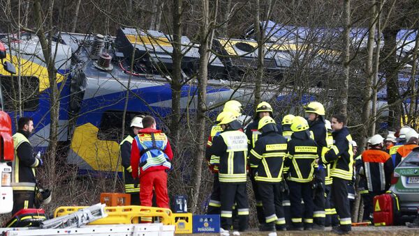 Members of emergency services stand next to a crashed train near Bad Aibling in southwestern Germany, February 9, 2016 - Sputnik International