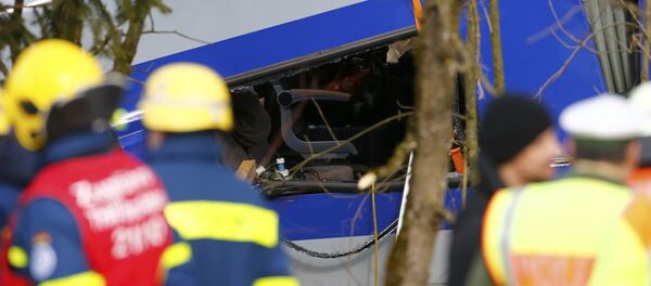 Members of emergency services work at the site of the two crashed trains near Bad Aibling in southwestern Germany Members of emergency services work at the site of the two crashed trains near Bad Aibling in southwestern Germany - Sputnik International