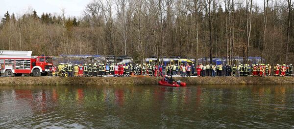 Members of emergency services work at the site of the two crashed trains near Bad Aibling in southwestern Germany, February 9, 2016 Members of emergency services work at the site of the two crashed trains near Bad Aibling in southwestern Germany, February 9, 2016 - Sputnik International