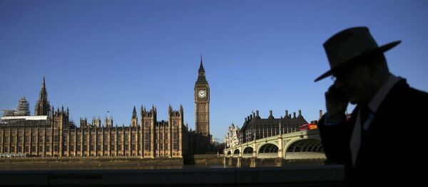 A man is silhouetted in front of the Houses of Parliament on a sunny winter's morning in London, Britain January 15, 2016. A man is silhouetted in front of the Houses of Parliament on a sunny winter's morning in London, Britain January 15, 2016. - Sputnik International
