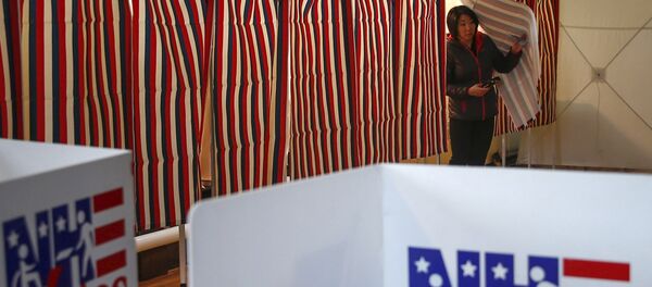 A woman looks to cast her ballot after voting in New Hampshire's first-in-the-nation primary in Bethelehem Town Hall, New Hampshire A woman looks to cast her ballot after voting in New Hampshire's first-in-the-nation primary in Bethelehem Town Hall, New Hampshire - Sputnik International