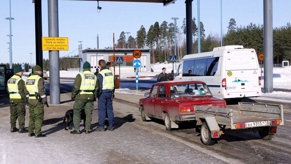 Picture taken 09 March 2005 shows a Russian registered car arriving at customs at the Pelkola international Border and Customs Station in Imatra, south-east Finland on the Finnish-Russian border - Sputnik International