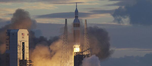 NASA Orion capsule on top of a Delta IV rocket lifts off on its first unmanned orbital test flight from Complex 37 B at the Cape Canaveral Air Force Station, Friday, Dec. 5, 2014 at Cape Canaveral, Fla - Sputnik International