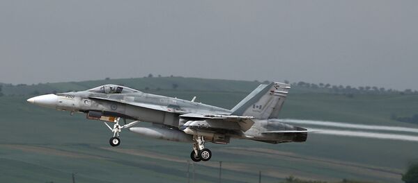 This file photo taken on May 28, 2014 shows a fighter type F-18 Hornet of the Canadian Royal Air Force taking off from the military airbase at Campia Turzii. Canada will end air strikes targeting the Islamic State group in Iraq and Syria and bring home its six fighter jets on February 22, the government announced February 8, 2016 This file photo taken on May 28, 2014 shows a fighter type F-18 Hornet of the Canadian Royal Air Force taking off from the military airbase at Campia Turzii. Canada will end air strikes targeting the Islamic State group in Iraq and Syria and bring home its six fighter jets on February 22, the government announced February 8, 2016 - Sputnik International