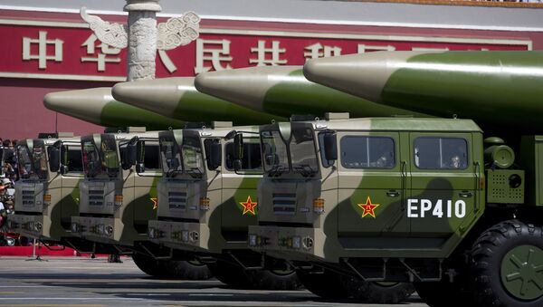 Military vehicles carrying DF-26 ballistic missiles drive past Tiananmen Gate during a military parade at Tiananmen Square in Beijing on September 3, 2015, to mark the 70th anniversary of victory over Japan and the end of World War II - Sputnik International