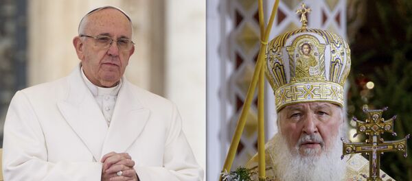 FILE - In this file photo combination Russian Orthodox Patriarch Kirill, right, serves the Christmas Mass in the Christ the Savior Cathedral in Moscow, Russia, on Thursday, Jan. 7, 2016 and Pope Francis prays during an audience at the Vatican on Saturday, Jan. 30, 2016 FILE - In this file photo combination Russian Orthodox Patriarch Kirill, right, serves the Christmas Mass in the Christ the Savior Cathedral in Moscow, Russia, on Thursday, Jan. 7, 2016 and Pope Francis prays during an audience at the Vatican on Saturday, Jan. 30, 2016 - Sputnik International