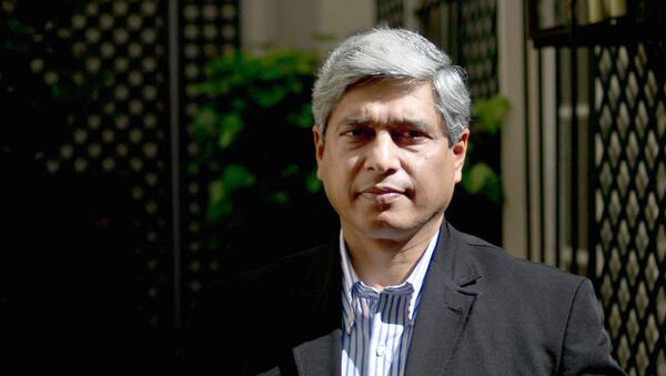 Vikas Swarup, Indian diplomat and author of the first novel Q&A, successfully adapted for the screen as Slumdog Millionaire poses on May 21, 2010 at his hotel in Paris - Sputnik International
