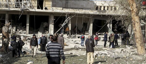 People inspect the damage after airstrikes by pro-Syrian government forces in the rebel held al-Sakhour neighbourhood of Aleppo, Syria February 5, 2016 - Sputnik International
