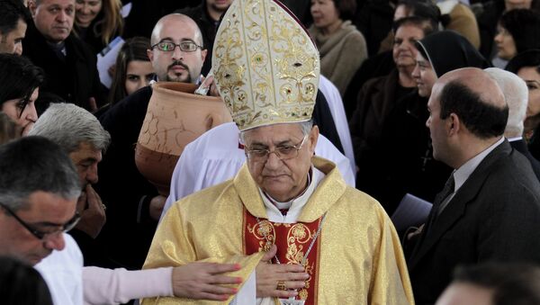Latin Patriarch of Jerusalem Fuad Twal leads an annual pilgrimage to the Baptism Site in Bethany, Jordan, on January 10, 2014 - Sputnik International